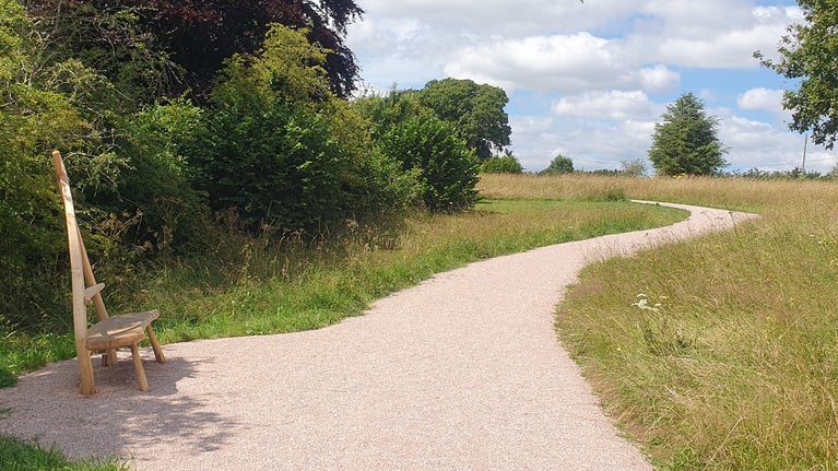 Perimeter Path, bench and meadow at A la Ronde, Devon.